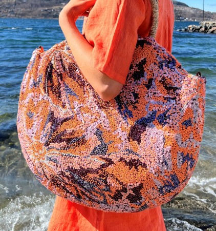 Rund stor orange paljettveske